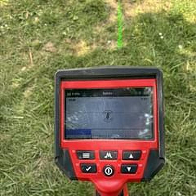 Sewer line video camera inspection monitor on grass