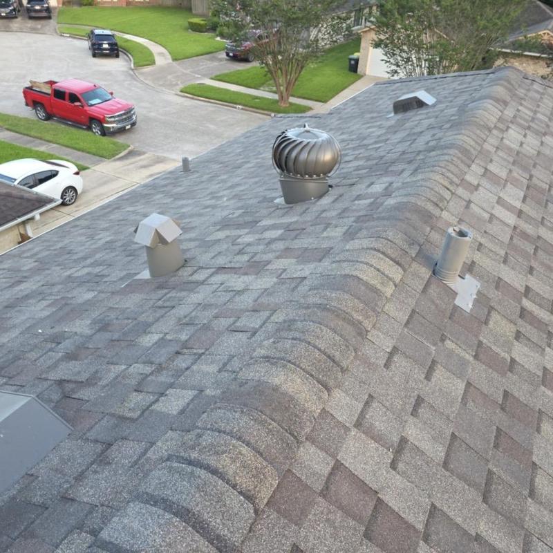 Roof ridge with vents and new asphalt shingles