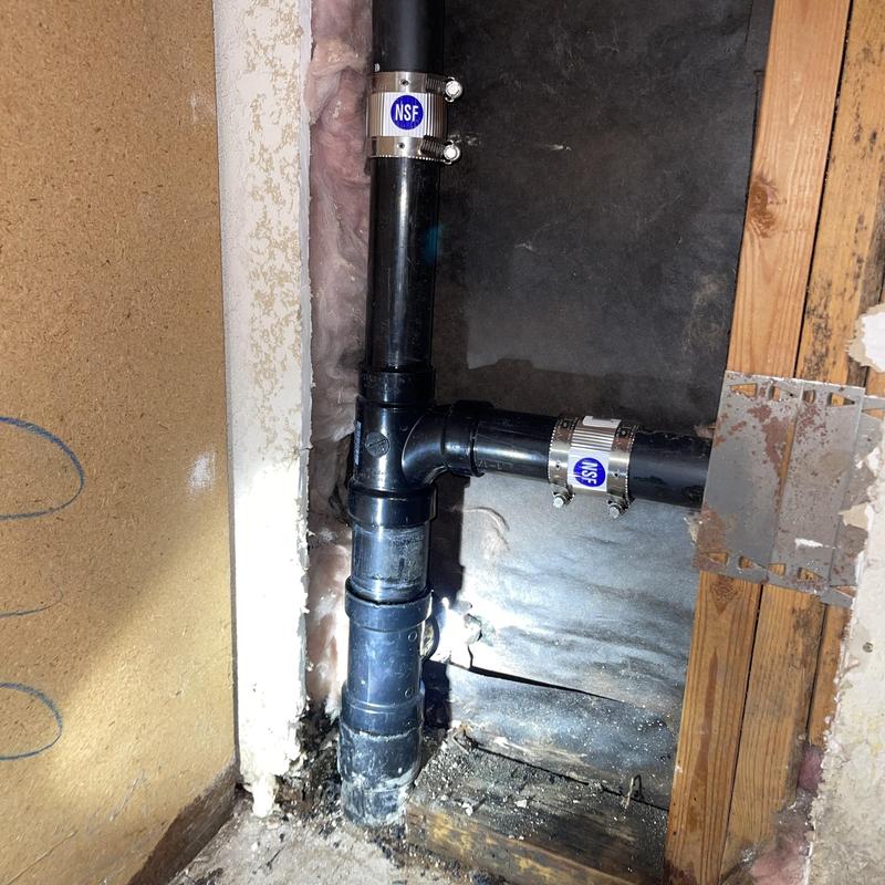 ABS drain line with new fittings and repair bands