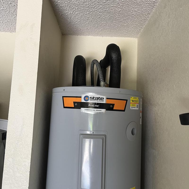 Electric water heater with insulated pipes installed Electric water heater with insulated pipes installed