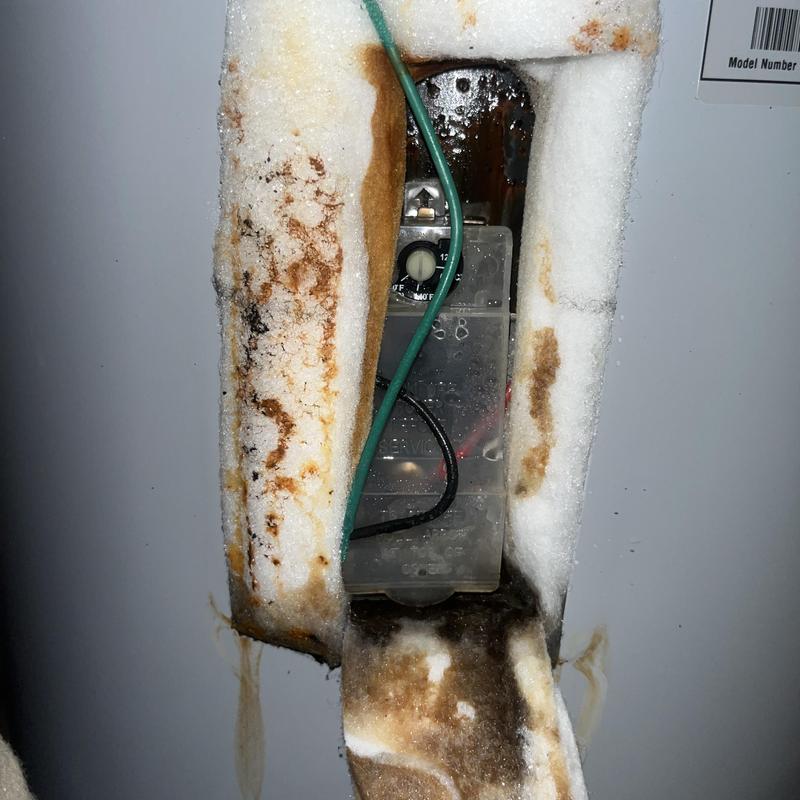 Electric water heater thermostat with rusted insulation Electric water heater thermostat with rusted insulation