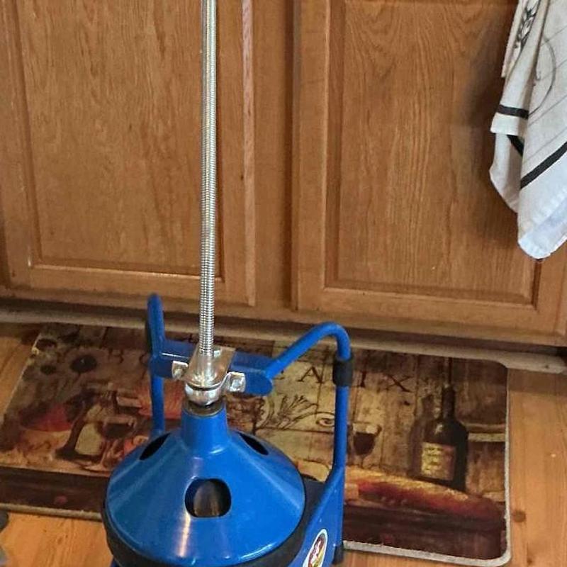 Kitchen sink drain line with drain auger tool