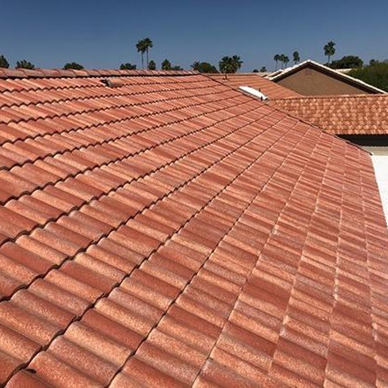Tile roof with damaged tiles on a sunny day Tile roof with damaged tiles on a sunny day