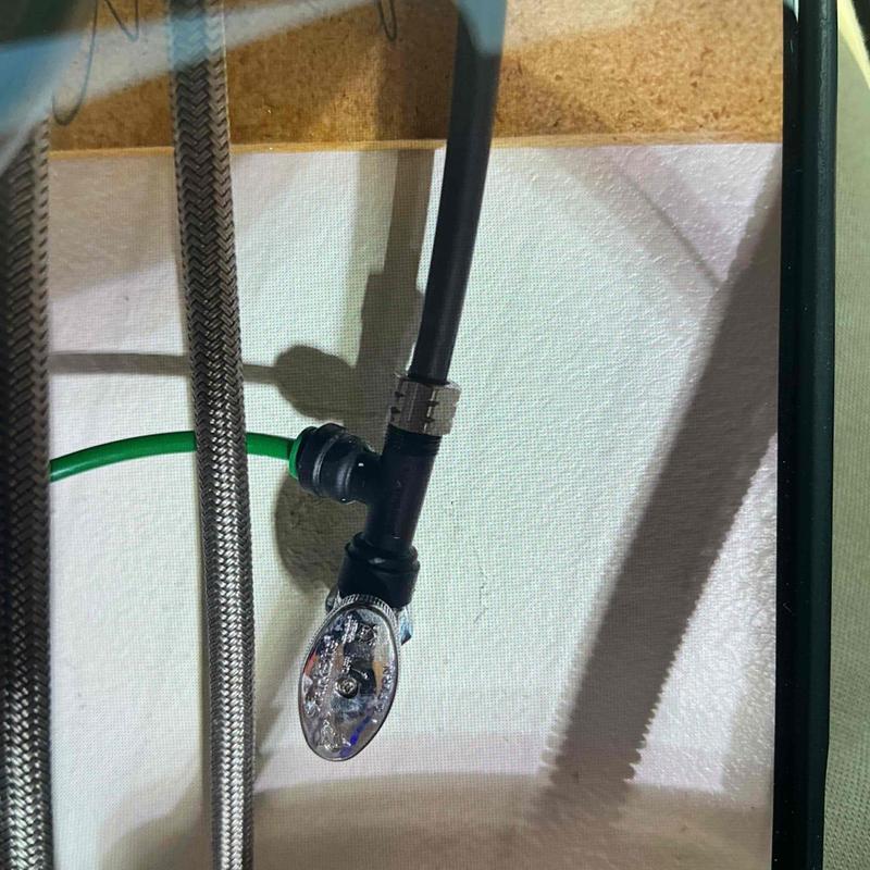 Kitchen sink hot and cold angle stop valves under cabinet