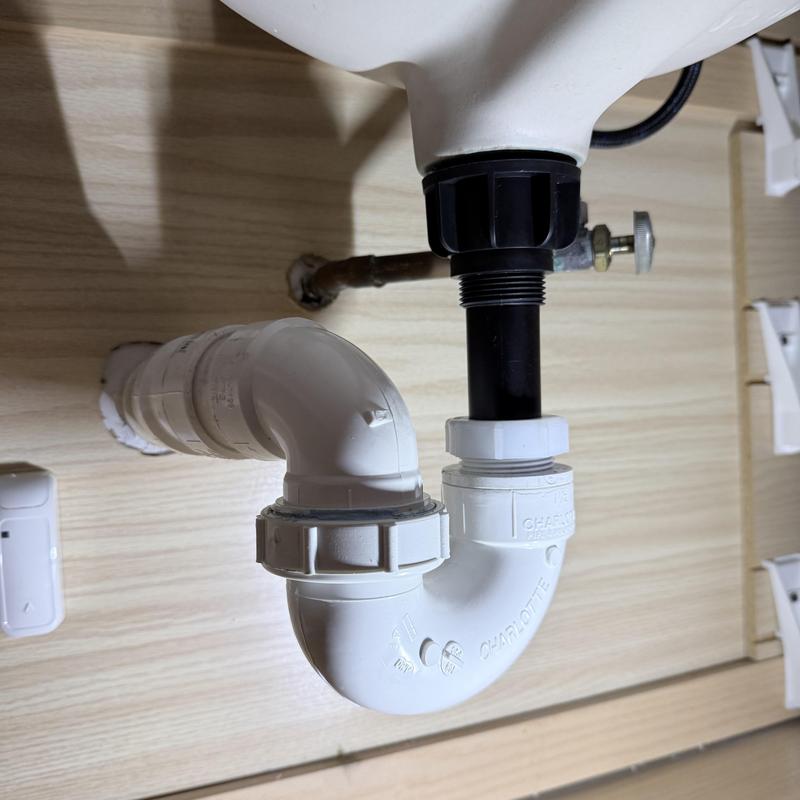 Sink drain trap and water supply valve installation under sink Sink drain trap and water supply valve installation under sink