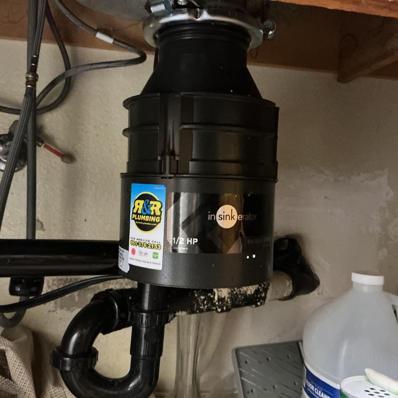 Garbage disposal unit and plumbing under sink installation
