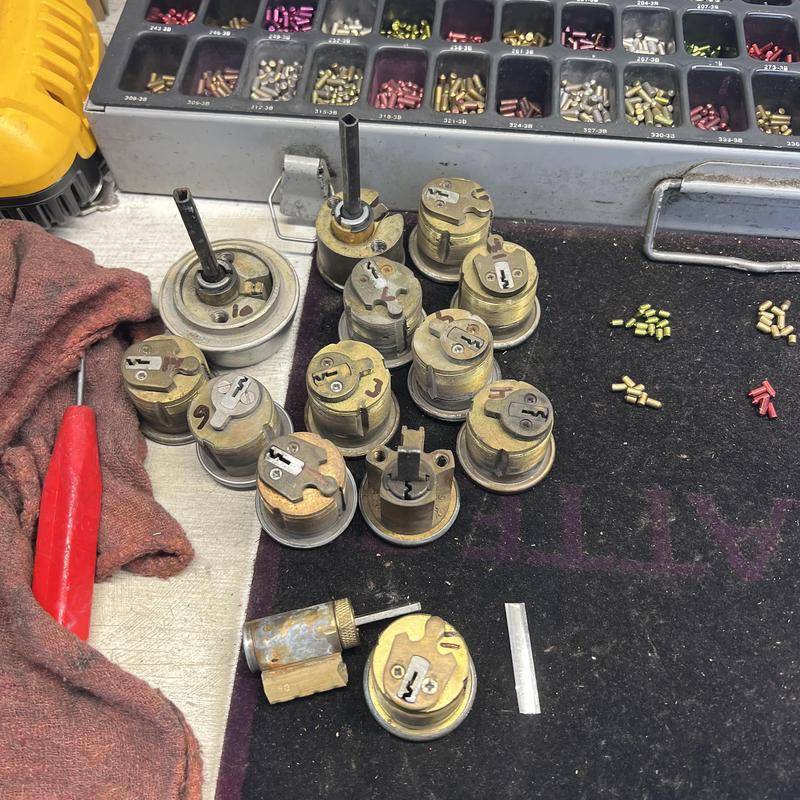 Lock cylinders and pins for rekeying on workbench