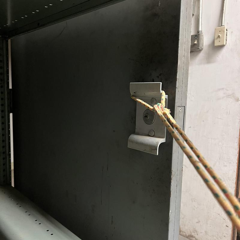 Door lock with keyhole and rope secured