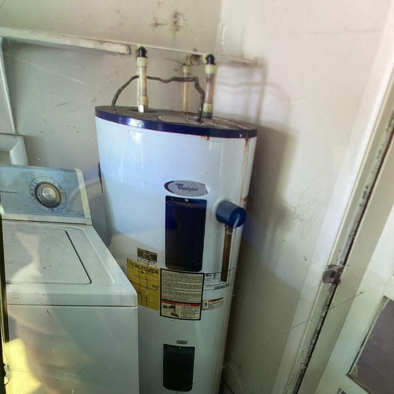 Water heater with expansion tank and piping in garage Water heater with expansion tank and piping in garage