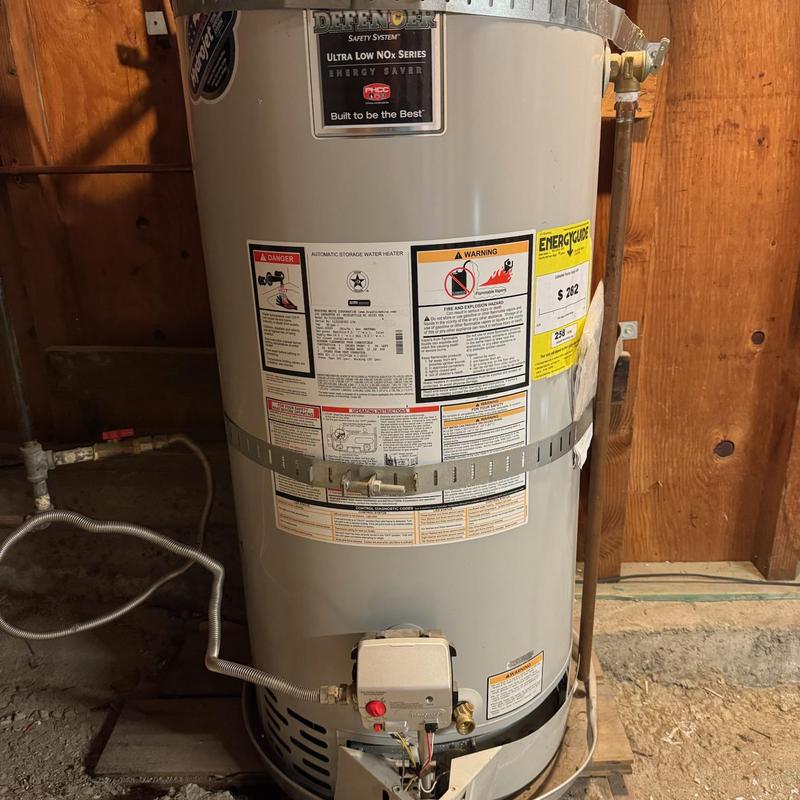 Water heater with new water and gas connections installed