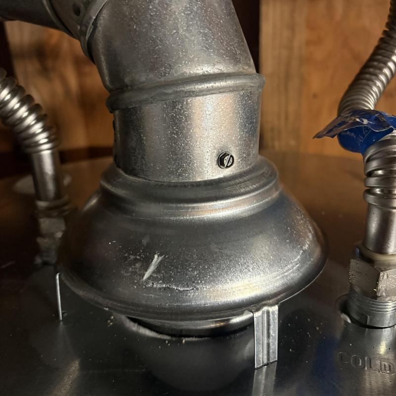 Water heater vent pipe and supply lines installation