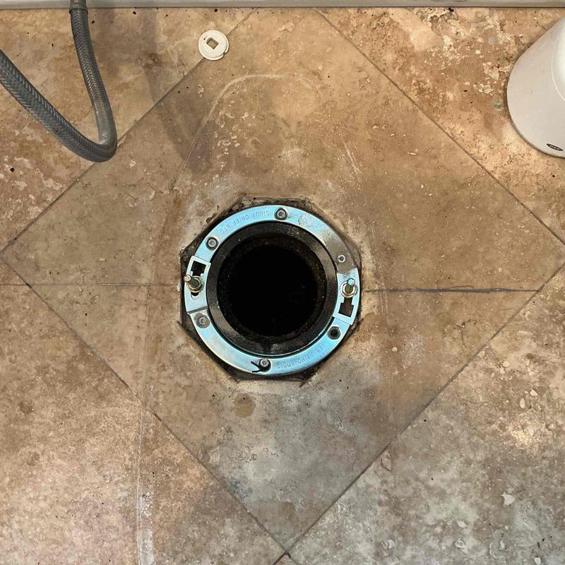 Toilet flange ring on tiled floor for bidet install