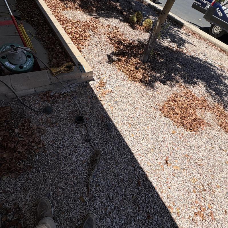 Outdoor drain line with cleaning machine cable