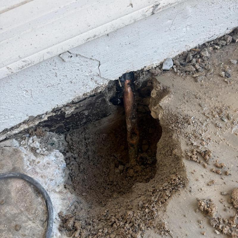 1 Inch Water Line exposed in concrete slab hole