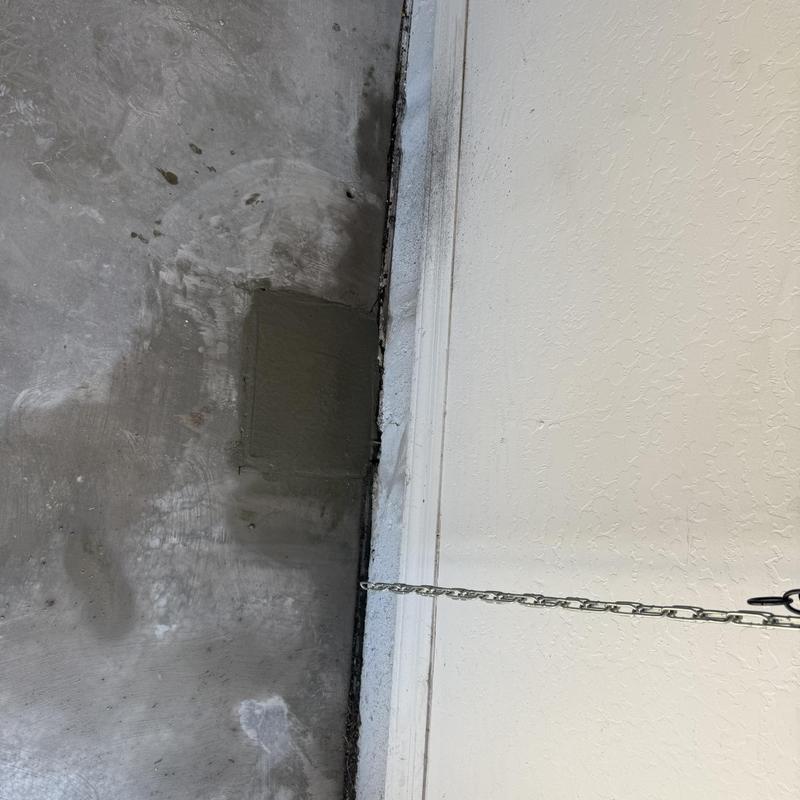 1 inch water line concrete patch near wall base