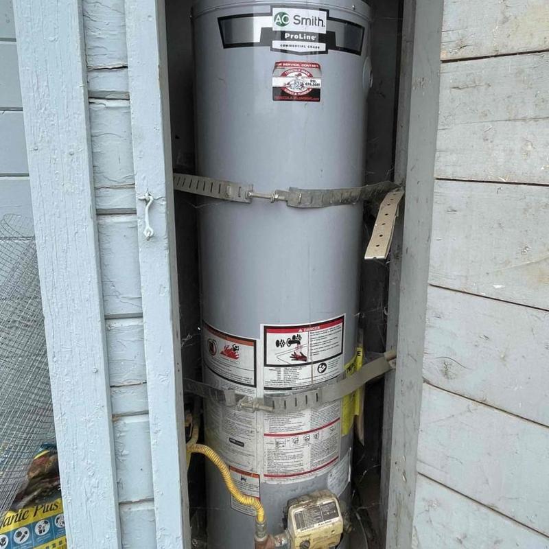 Water heater tank flushing and sediment removal in closet