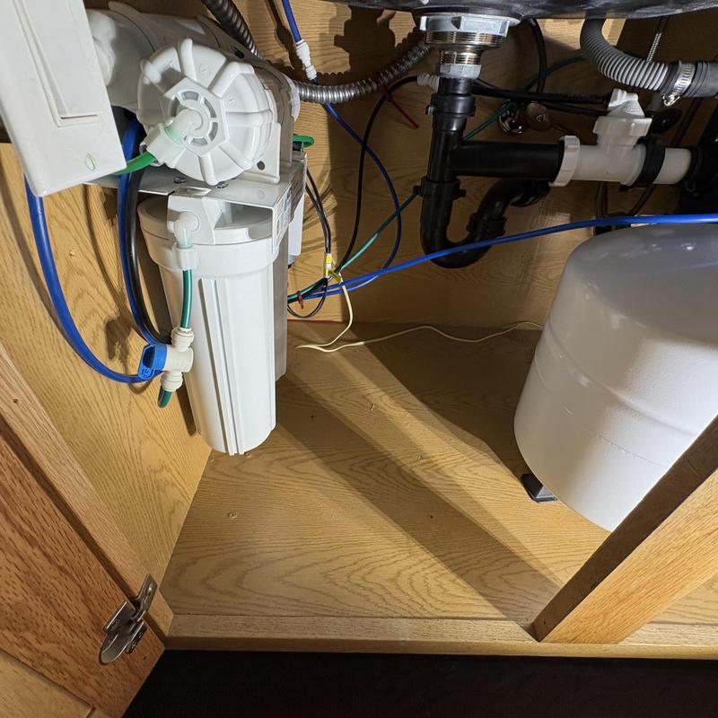 Reverse osmosis water filter system installation under sink