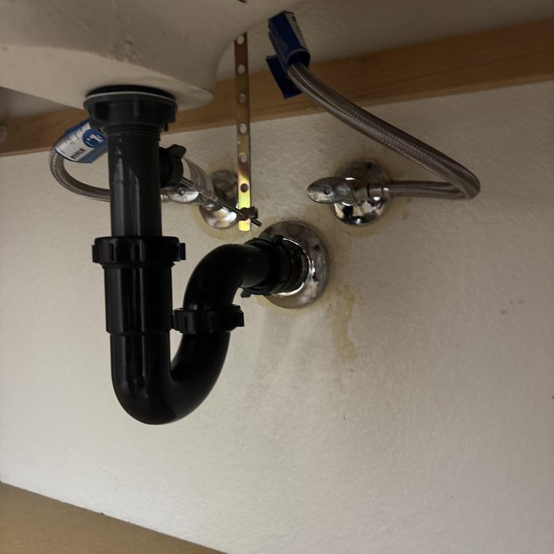 Lavatory sink drain pipe with water supply lines in Glendale