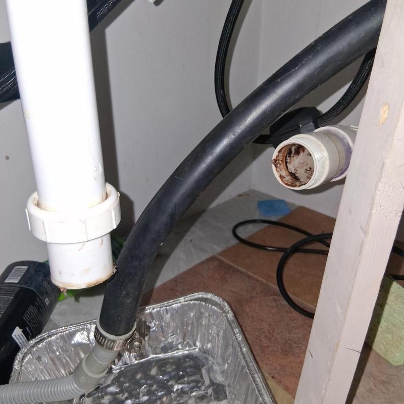 Kitchen drain pipe with cable snake cleaning setup