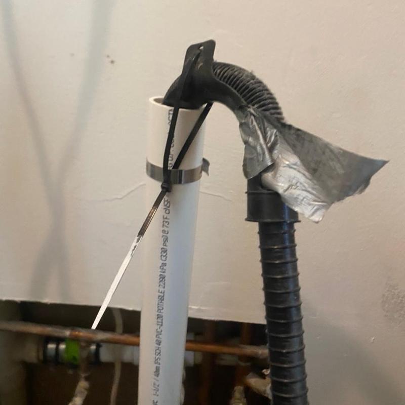 Laundry standpipe with vent pipe secured by duct tape