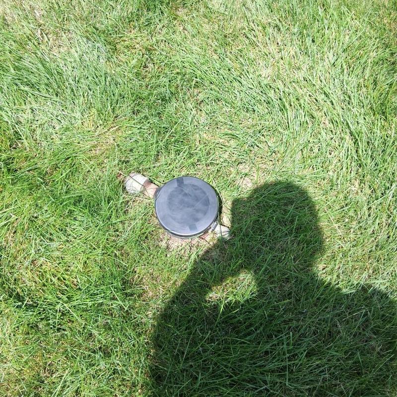 Well head with Fernco cap installed in grass