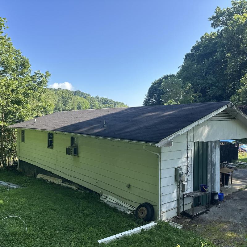 Asphalt shingle roof on residential garage building Asphalt shingle roof on residential garage building