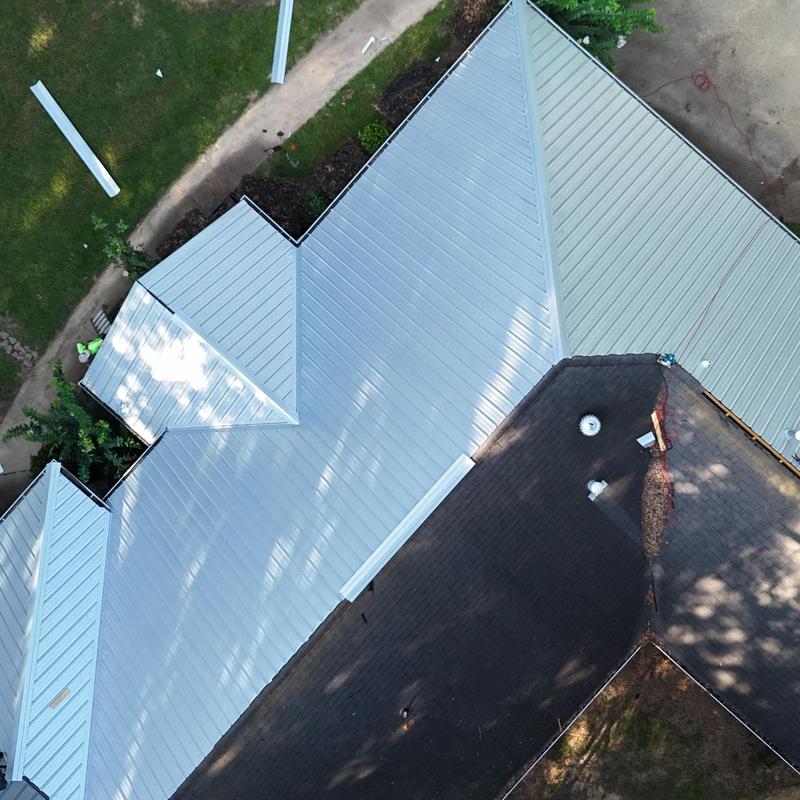 Metal roof panels installation on residential home