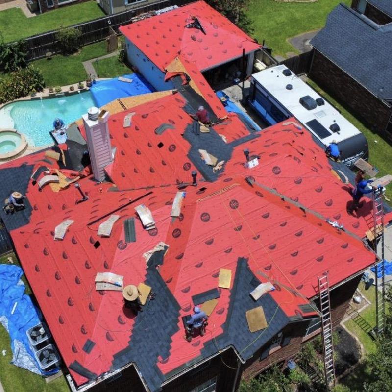 Roof underlayment installation on residential home