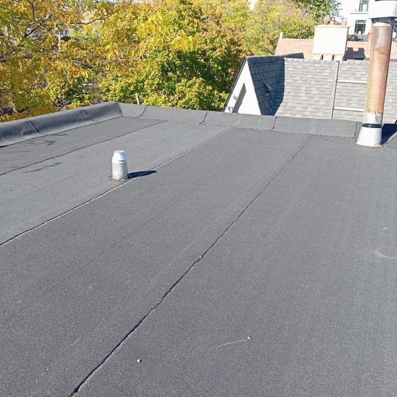 Flat roof with vent pipe and chimney inspection Flat roof with vent pipe and chimney inspection