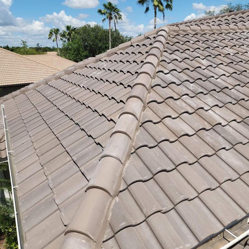 Tile roof ridge and tiles inspection on residential home Tile roof ridge and tiles inspection on residential home