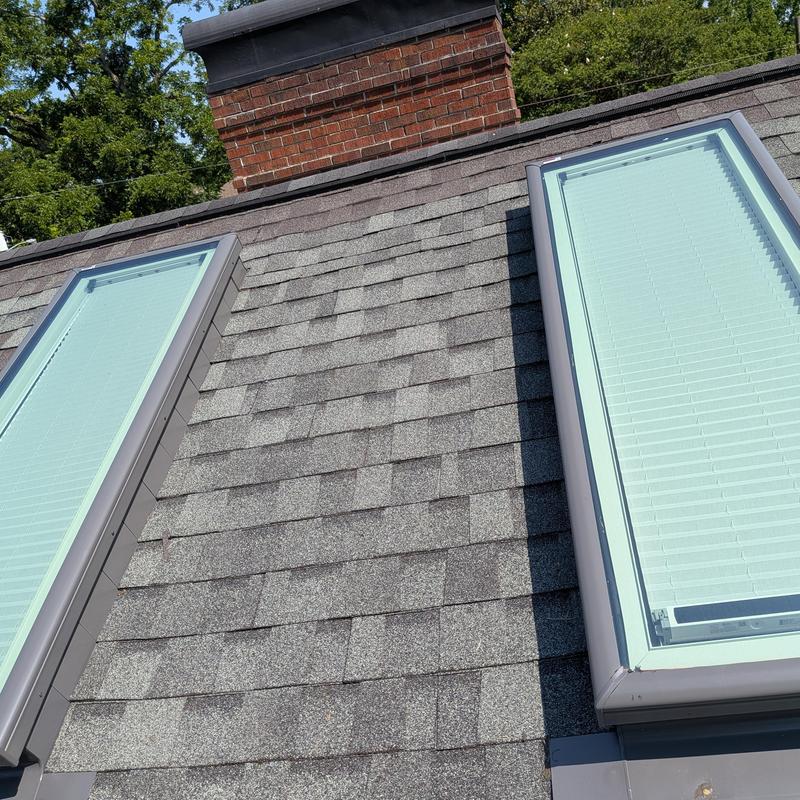 Velux skylights installed on gray shingle roof