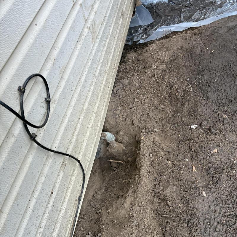 Gas line with leak test near home foundation dirt excavation Gas line with leak test near home foundation dirt excavation