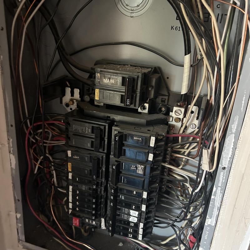 Electrical breaker panel with multiple circuit breakers and wiring Electrical breaker panel with multiple circuit breakers and wiring