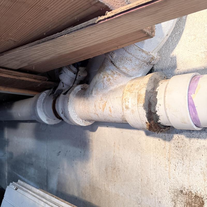 Cast iron drain pipe with PVC replacement fitting Cast iron drain pipe with PVC replacement fitting