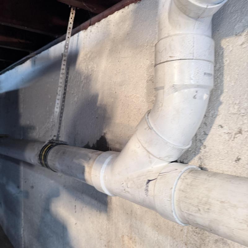 PVC drain pipe replacement with new fittings in basement wall PVC drain pipe replacement with new fittings in basement wall