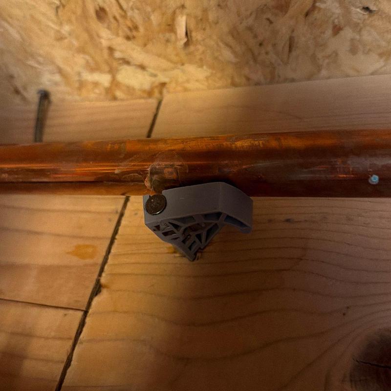 Copper hot water line pipe with mounting bracket Copper hot water line pipe with mounting bracket