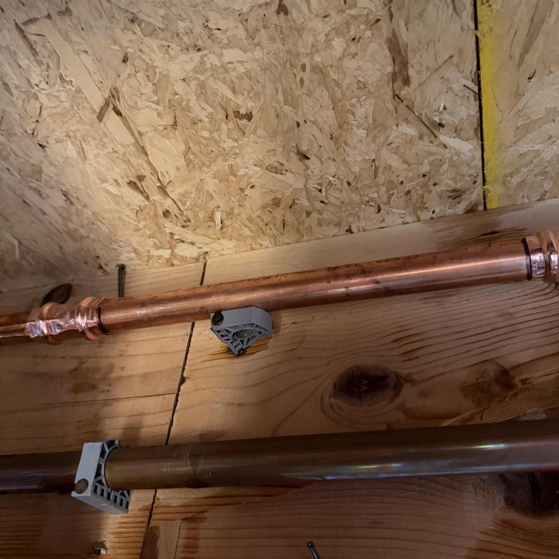 Copper hot water line with pipe supports installation Copper hot water line with pipe supports installation