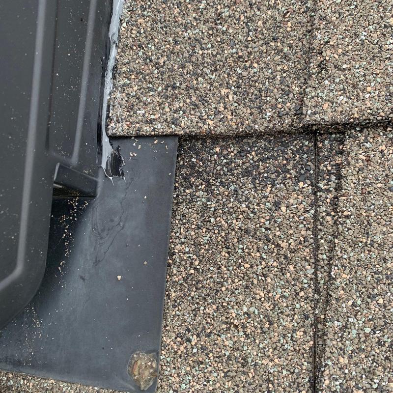 Roof shingles and metal flashings with sealant applied