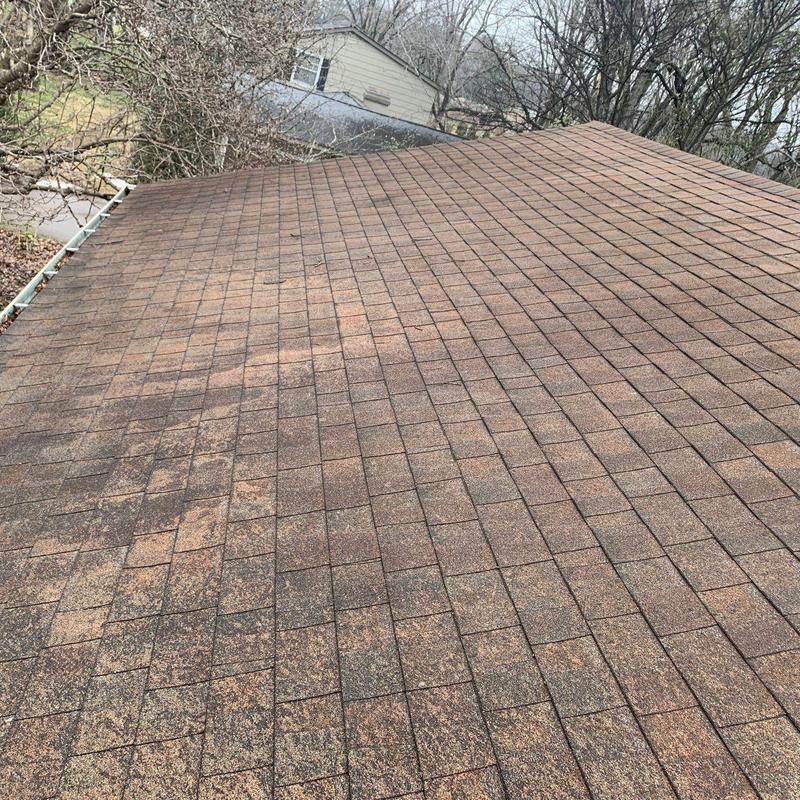 Asphalt shingle roof with visible hail damage