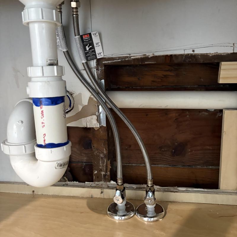 Kitchen sink waterlines rerouted through flooring Kitchen sink waterlines rerouted through flooring