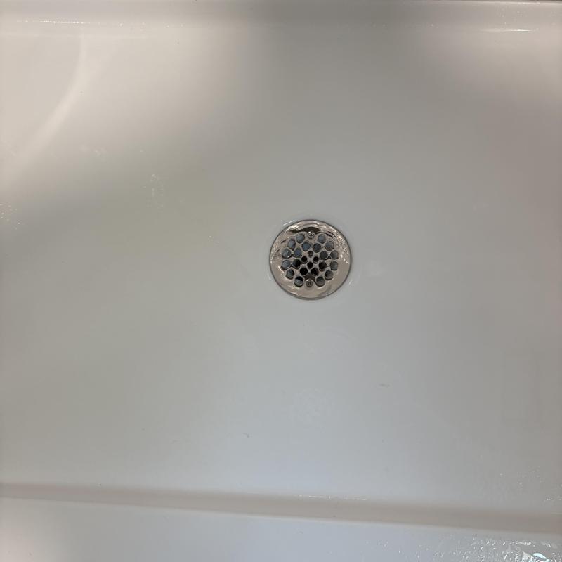 Shower drain with new glue-type strainer installed Shower drain with new glue-type strainer installed