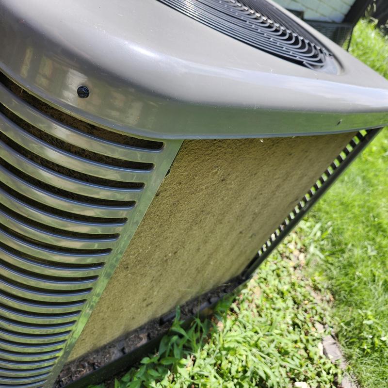 Condenser coils clogged with dust on HVAC unit Condenser coils clogged with dust on HVAC unit