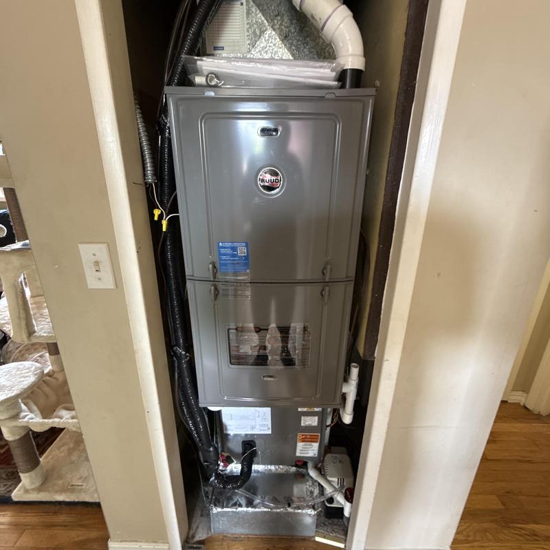 Ruud high-efficiency gas furnace installed in utility closet Ruud high-efficiency gas furnace installed in utility closet
