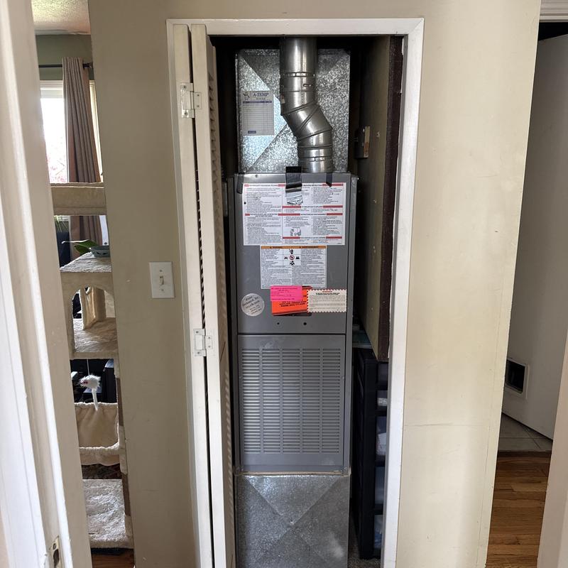 Ruud gas furnace with vent pipe in utility closet Ruud gas furnace with vent pipe in utility closet