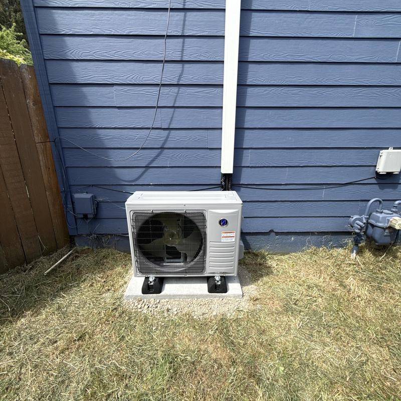 Friedrich heat pump unit installed outside home Friedrich heat pump unit installed outside home
