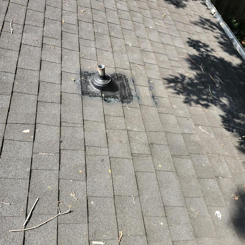 Roof vent boot and aged asphalt shingles on roof Roof vent boot and aged asphalt shingles on roof