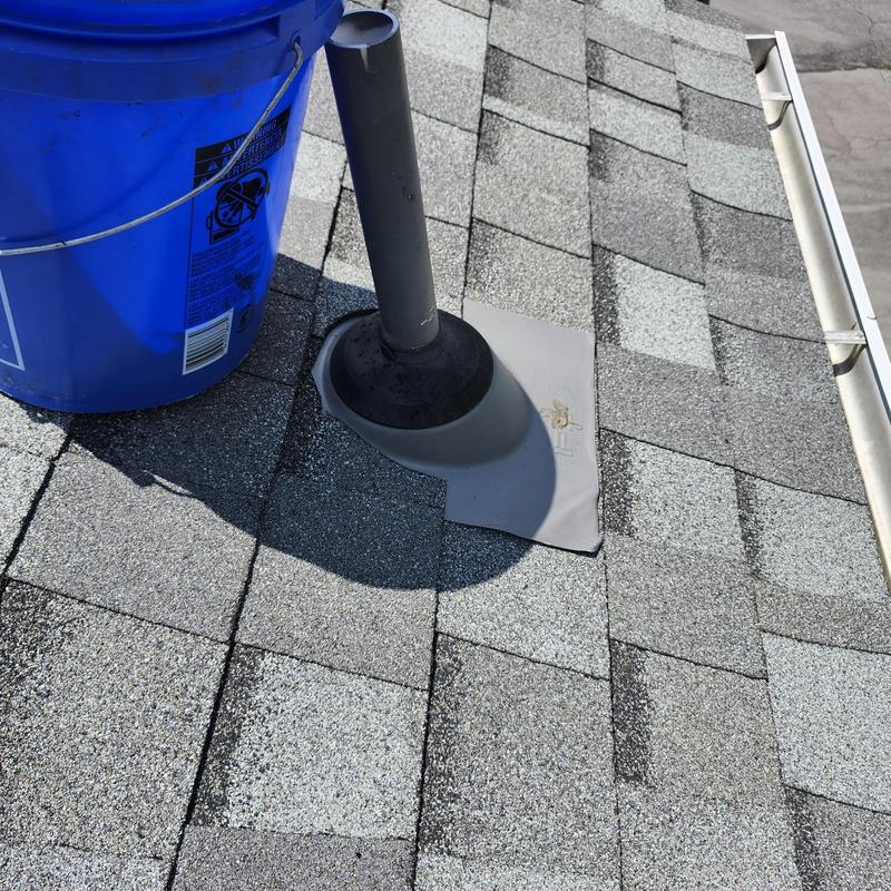 Roof vent pipe flashing and shingle repair on asphalt roof Roof vent pipe flashing and shingle repair on asphalt roof