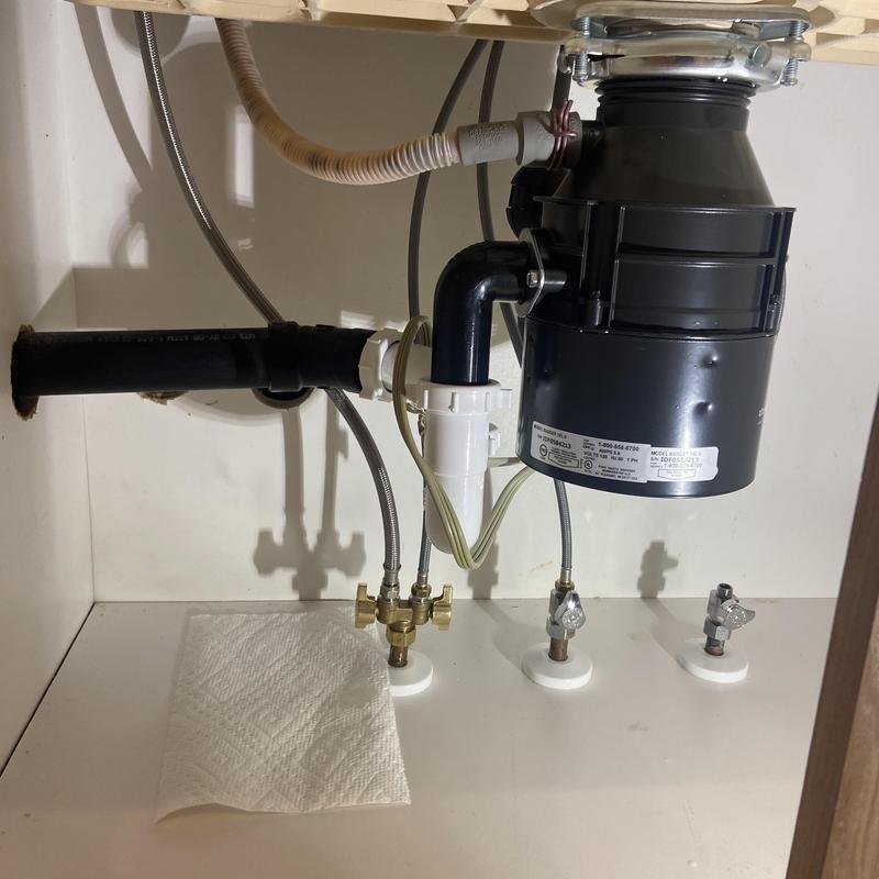 Kitchen disposal and drain piping under sink with valves Kitchen disposal and drain piping under sink with valves