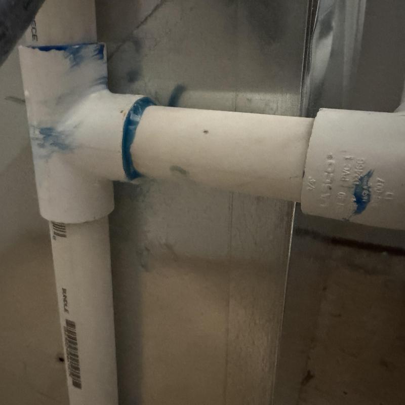 PVC condensate drain line joint sealed with glue PVC condensate drain line joint sealed with glue