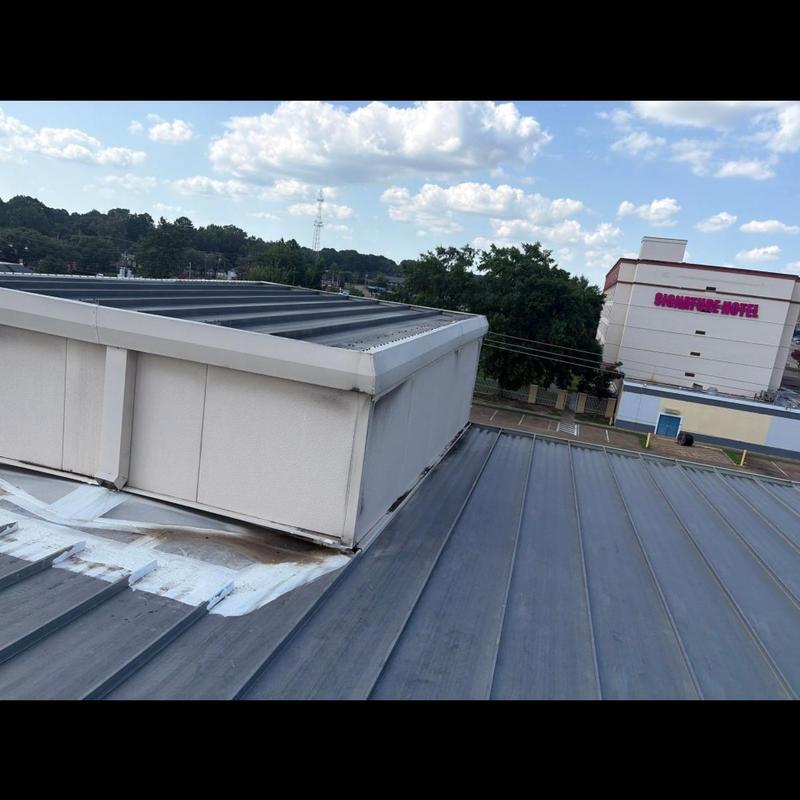Standing seam metal roof near rooftop structure